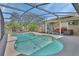 Enjoy this private, screened-in pool, with outdoor furniture and a grill, perfect for entertaining at 1963 Stacey Cir, Deltona, FL 32738