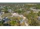 Aerial view of a wooded neighborhood with homes featuring large lots and mature trees at 201 Williams Ave, Orange City, FL 32763