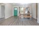 Open concept dinning room with natural lighting and neutral colored flooring and walls at 201 Williams Ave, Orange City, FL 32763