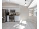 Bright kitchen featuring modern appliances, white cabinetry, and natural lighting at 201 Williams Ave, Orange City, FL 32763