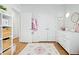 Well-organized bedroom with plush rug, closet, dresser, and decorative items offering ample space at 214 Caryota Ct, New Smyrna Beach, FL 32168