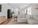 Inviting living room showcasing a stylish entertainment center and a comfortable sectional couch at 214 Caryota Ct, New Smyrna Beach, FL 32168