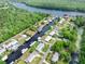 Stunning aerial view of the riverfront community, displaying the unique layout and access to waterways at 24919 Drive No 1, Astor, FL 32102