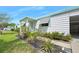 Charming home exterior with well-maintained landscaping, a covered porch, and inviting curb appeal at 24919 Drive No 1, Astor, FL 32102