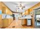 Open kitchen featuring wood-look flooring, a dishwasher, and ample cabinet space, perfect for cooking and entertaining at 24919 Drive No 1, Astor, FL 32102