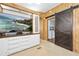 Comfortable living area with barn door leading to laundry, and built-in media center at 24919 Drive No 1, Astor, FL 32102