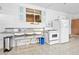 Outdoor patio featuring a utility sink, oven and fridge plus a tile floor at 24919 Drive No 1, Astor, FL 32102