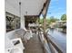 Relaxing porch with waterfront views, cozy seating, and peaceful scenery at 24919 Drive No 1, Astor, FL 32102