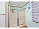 Modern shower with sliding glass doors and a multi-setting shower head at 24919 Drive No 1, Astor, FL 32102