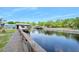 Scenic waterfront view from the dock along a tranquil canal at 24919 Drive No 1, Astor, FL 32102
