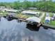 Waterfront home featuring a private boat dock, canal access, and lush landscaping for serene waterfront living at 24919 Drive No 1, Astor, FL 32102