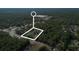 Highlighted aerial view of wooded land for sale near roadways, showing location and potential for development at 26 E Kelly Park Rd, Apopka, FL 32712