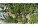 A beautiful property featuring lush tree coverage and a home near the roadway at 26 E Kelly Park Rd, Apopka, FL 32712