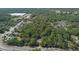 Breathtaking aerial view of a tree-filled neighborhood, featuring quiet residential streets at 26 E Kelly Park Rd, Apopka, FL 32712