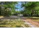 Inviting long driveway surrounded by lush trees and greenery at 26 E Kelly Park Rd, Apopka, FL 32712