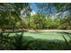 A clear spring surrounded by lush trees offers a serene and inviting outdoor space at 26 E Kelly Park Rd, Apopka, FL 32712