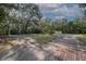 Expansive grass yard featuring a small shack and a yellow metal shed at 26 E Kelly Park Rd, Apopka, FL 32712
