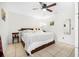 Bright bedroom with tile flooring, a ceiling fan, art on the walls, and a comfortable queen-size bed at 3228 Unity Tree Dr, Edgewater, FL 32141