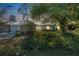 Charming home with mature trees and lush landscaping creating a serene and inviting entrance at 3228 Unity Tree Dr, Edgewater, FL 32141