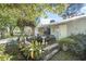 Front yard with mature landscaping, small walkway, and accents that create a welcoming entrance at 3228 Unity Tree Dr, Edgewater, FL 32141