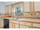 Well-maintained kitchen featuring a window, neutral countertops, and modern appliances at 3228 Unity Tree Dr, Edgewater, FL 32141