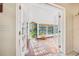 Bright sunroom featuring tile floors and multiple windows offering natural light and garden views at 3228 Unity Tree Dr, Edgewater, FL 32141