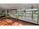 Bright sunroom featuring tile floors and multiple windows offering natural light and garden views at 3228 Unity Tree Dr, Edgewater, FL 32141