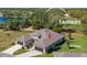 Stunning aerial view of home with a well-manicured lawn, backing onto the lush green fairway of the golf course at 3329 Bailey Ann Dr, Ormond Beach, FL 32174
