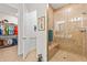 Tiled shower with built-in bench seat and a view of a large walk-in closet at 3329 Bailey Ann Dr, Ormond Beach, FL 32174