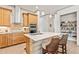 Modern kitchen with stainless steel appliances, a center island with seating, and ample cabinet space at 3329 Bailey Ann Dr, Ormond Beach, FL 32174