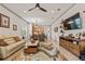 Open floor plan featuring living room, dining area, and kitchen with stainless steel appliances and modern lighting at 3329 Bailey Ann Dr, Ormond Beach, FL 32174