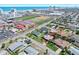 Residential neighborhood with houses, green spaces, swimming pools, and proximity to a sports complex at 354 Georgetown Dr, Daytona Beach, FL 32118