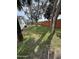 Expansive backyard featuring a glimpse of the pool, lush greenery, and a glimpse of the home's exterior at 354 Georgetown Dr, Daytona Beach, FL 32118