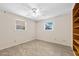 A bright bedroom has wood-look floors and a ceiling fan at 354 Georgetown Dr, Daytona Beach, FL 32118