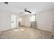 Spacious bedroom featuring light-colored hardwood floors, a ceiling fan, and a mirrored closet at 354 Georgetown Dr, Daytona Beach, FL 32118
