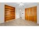 Bedroom with wood-look floors and a large built-in bookcase at 354 Georgetown Dr, Daytona Beach, FL 32118