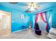 Whimsical bedroom featuring vibrant blue walls and creative decorative accents at 354 Georgetown Dr, Daytona Beach, FL 32118