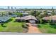 Charming single-story home with a long driveway, mature landscaping, and a well-manicured front lawn at 354 Georgetown Dr, Daytona Beach, FL 32118