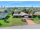 Charming single-story home with a long driveway, mature landscaping, and a well-manicured front lawn at 354 Georgetown Dr, Daytona Beach, FL 32118