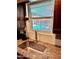 Kitchen sink features stainless steel fixtures, granite counters, hexagon backsplash, and a window view of the pool at 354 Georgetown Dr, Daytona Beach, FL 32118