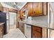 Renovated kitchen features stainless steel appliances, granite counters, and rustic wood cabinets at 354 Georgetown Dr, Daytona Beach, FL 32118