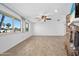 Bright living room with large windows offering plenty of natural light and wood-look flooring at 354 Georgetown Dr, Daytona Beach, FL 32118
