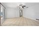 Bright living room with sliding glass doors and tile floors at 354 Georgetown Dr, Daytona Beach, FL 32118