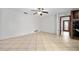 Large living room features tile floors, access to the kitchen, and lots of natural light at 354 Georgetown Dr, Daytona Beach, FL 32118
