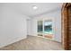 Bright room with a slider looking out to a pool at 354 Georgetown Dr, Daytona Beach, FL 32118