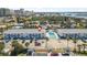Inviting aerial view of building with pool, lush landscaping, and convenient parking at 3620 Cardinal Blvd # 80, Daytona Beach, FL 32118