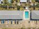 Aerial view of building with a refreshing pool and ample parking spaces at 3620 Cardinal Blvd # 80, Daytona Beach, FL 32118