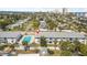 Lovely aerial view of building showcasing pool, surrounding greenery, and parking area at 3620 Cardinal Blvd # 80, Daytona Beach, FL 32118