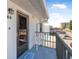Private balcony with exterior entrance features, including a welcome mat and building views at 3620 Cardinal Blvd # 80, Daytona Beach, FL 32118