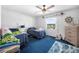 bedroom with ceiling fan, large window, and two twin beds at 3620 Cardinal Blvd # 80, Daytona Beach, FL 32118